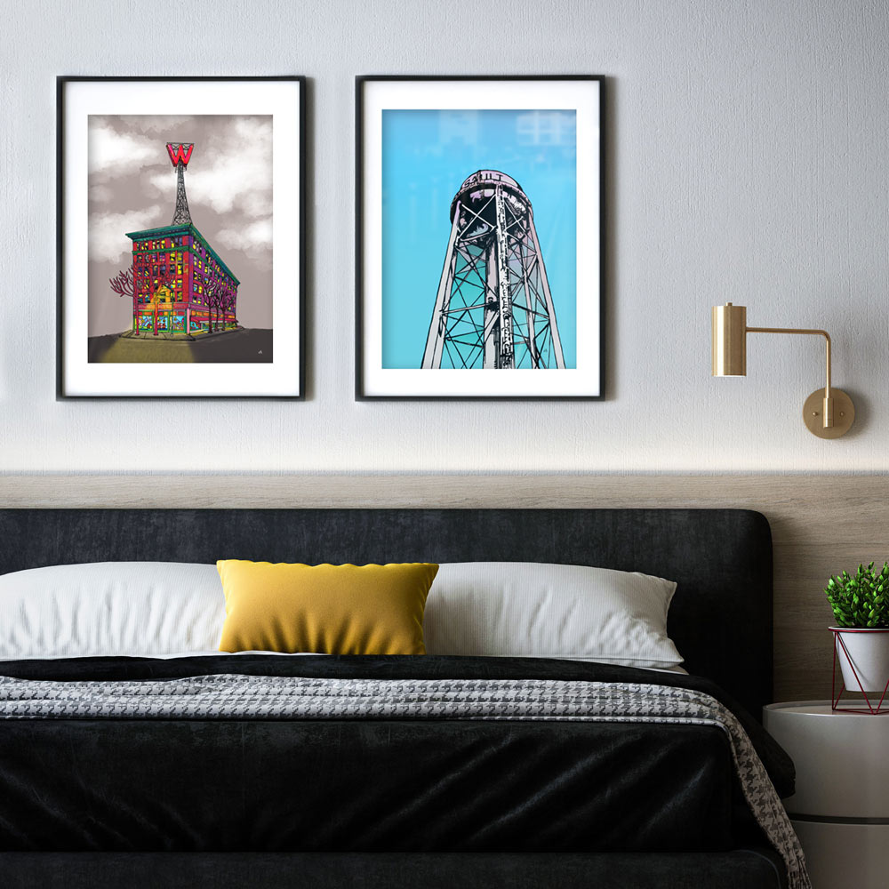 Long Sault Water tower framed on a wall above a bed. Print is hung next to a print of The W
