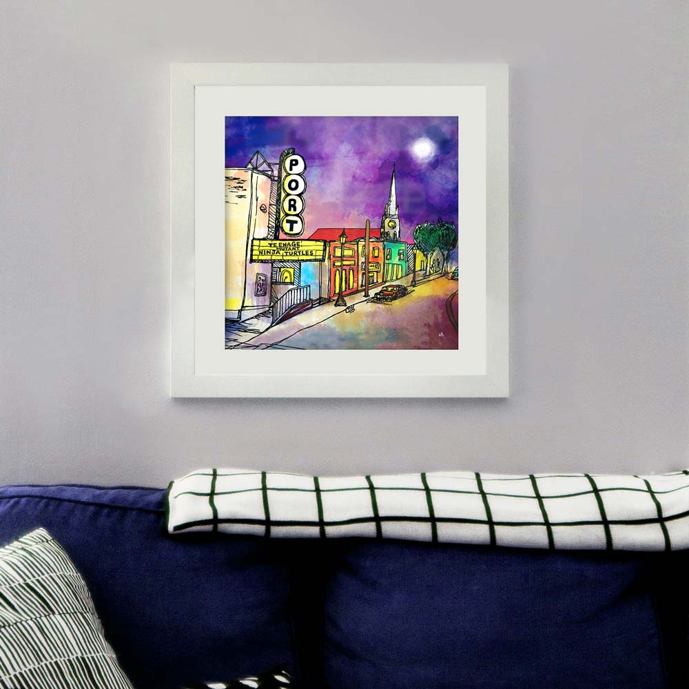 The Port Theatre framed print on white background in a living room